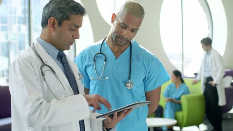 657312681-staff-room-apple-ipad-planning-multi-ethnic-group