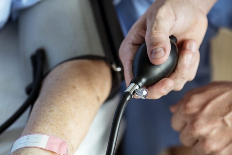 Elderly woman checking blood pressure