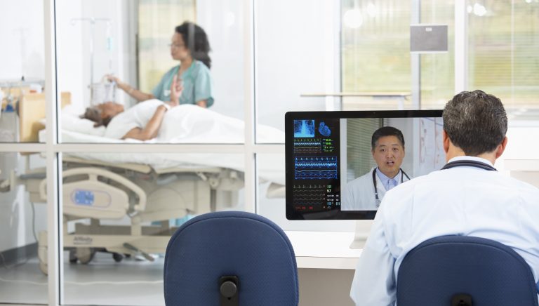 Doctors having teleconference in hospital