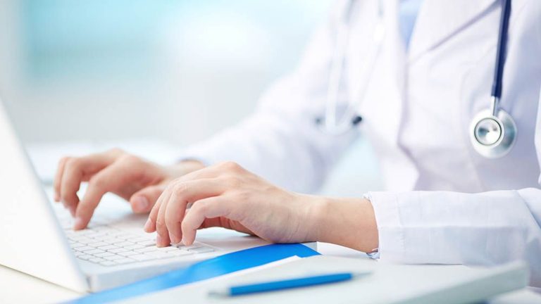 Medical person typing